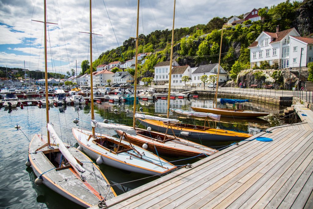 Old wooden boats and old wooden houses in the town of Risør Norway